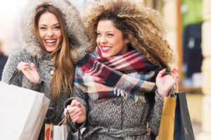 Two best girlfiends shopping together in warm clothing