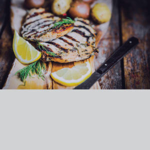 Tasty fish filets with fresh lemon slices