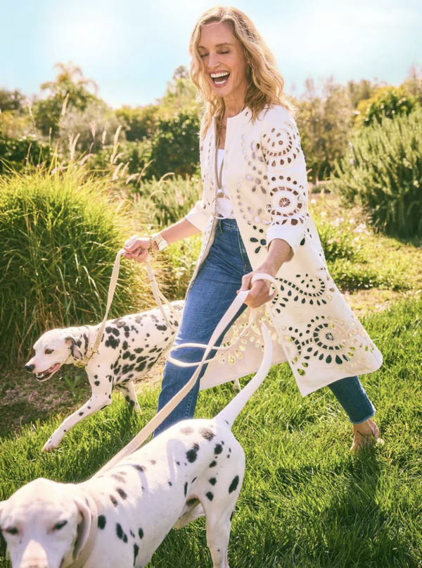 Woman walking dogs with long cardigan
