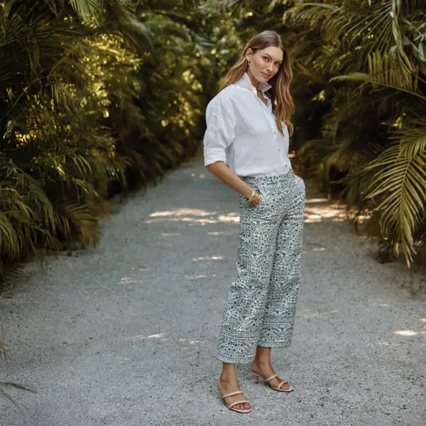 Girl wearing white blouse and b&w pants