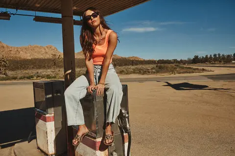 Girl in tank top and jeans