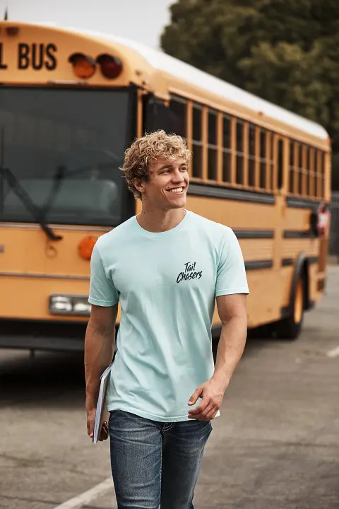 Guy walking away from school bus